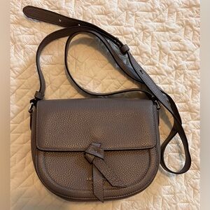 Kate Spade Knott Medium Saddle Bag in the color Orchid